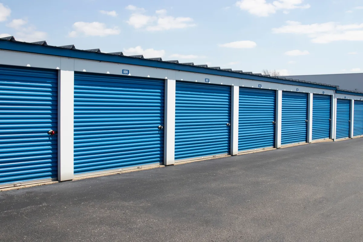 A row of blue drive up storage units